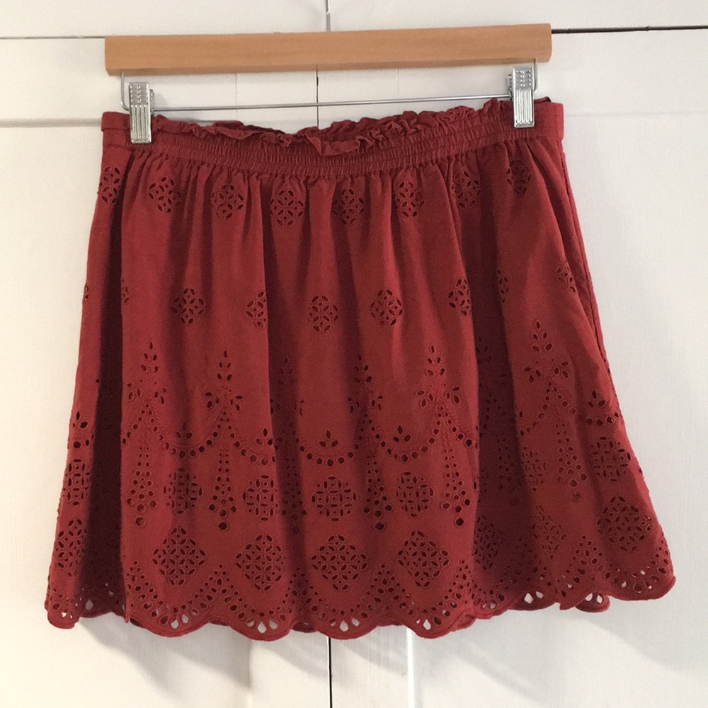 Red skirt with eyelet pattern